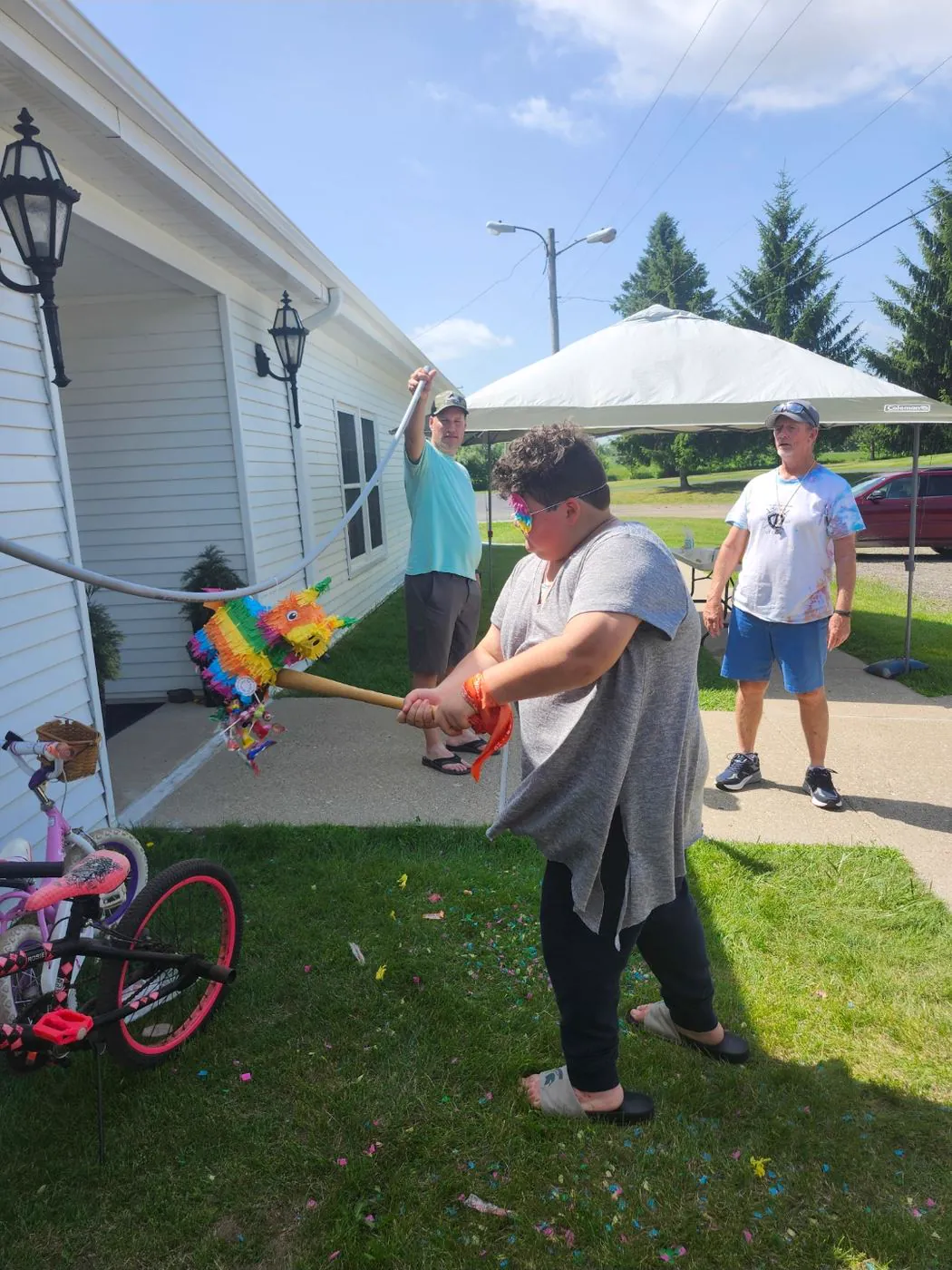 A child hitting the colorful pinata during VBS