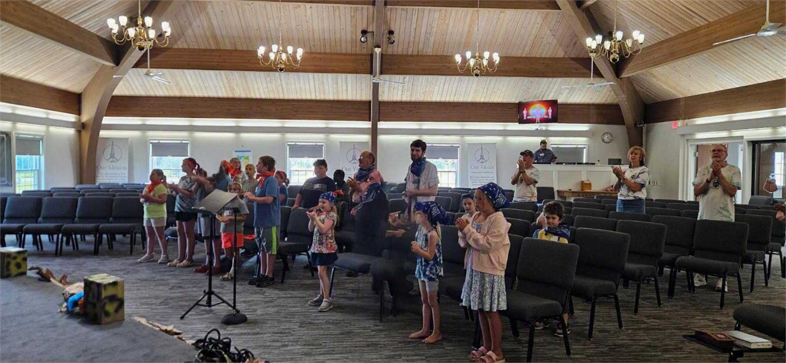 Children and leaders gathered during VBS story and singing time