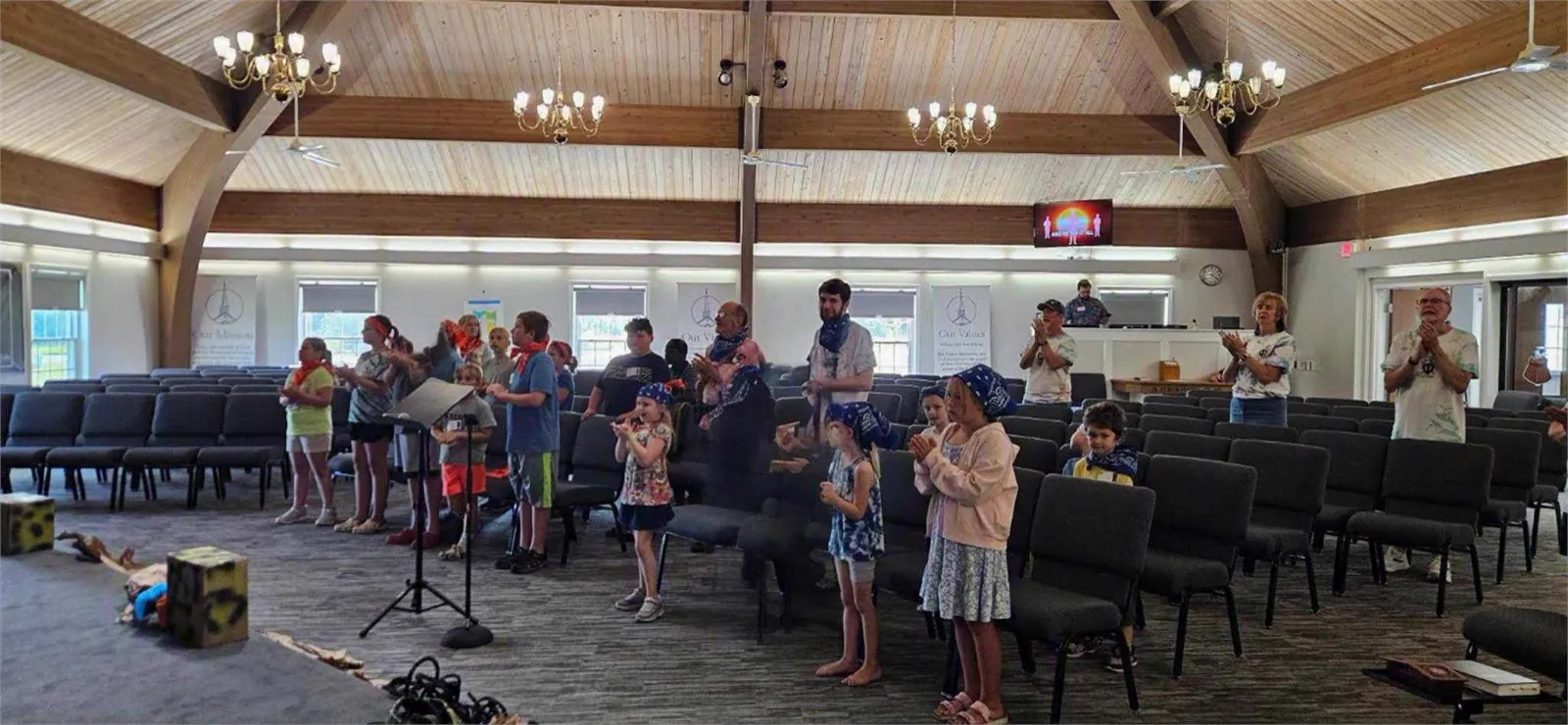 Children and leaders gathered during VBS story and singing time